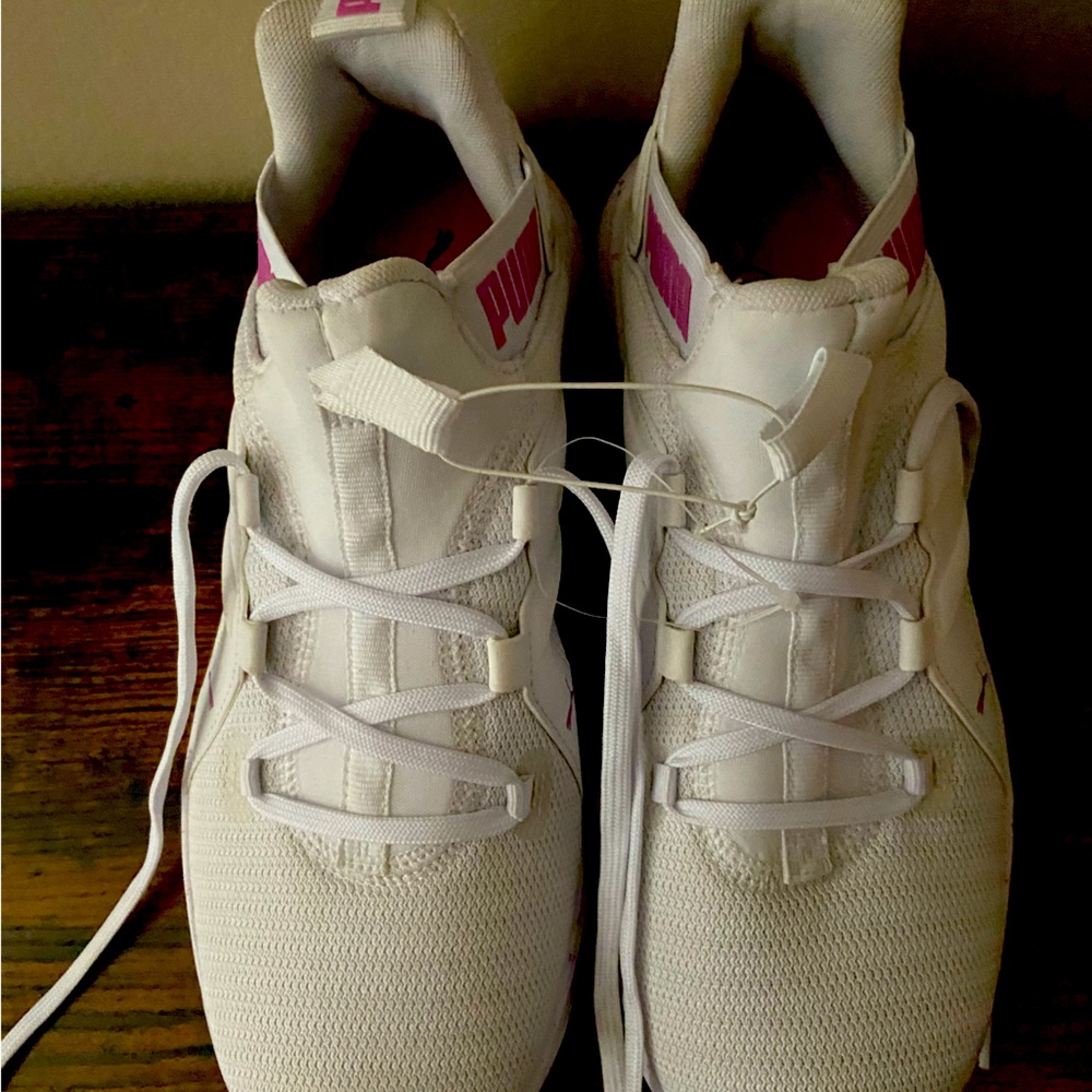 White Puma with pink detailing. Size 8 1/2. Never worn.